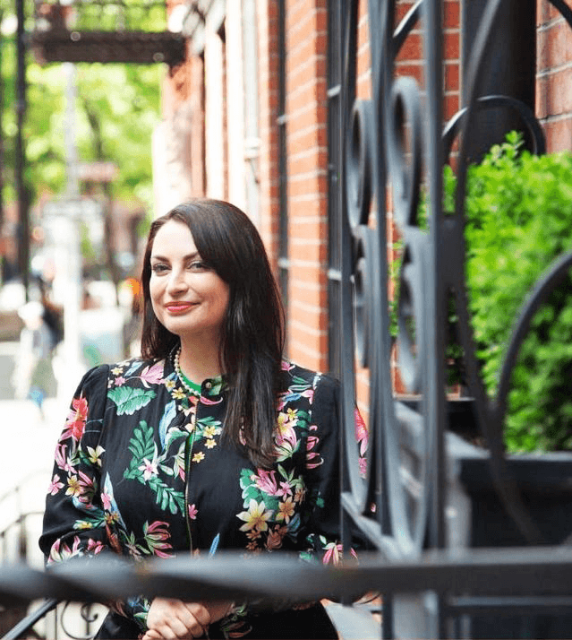Dr. Nelli Gluzman portrait by stair railings